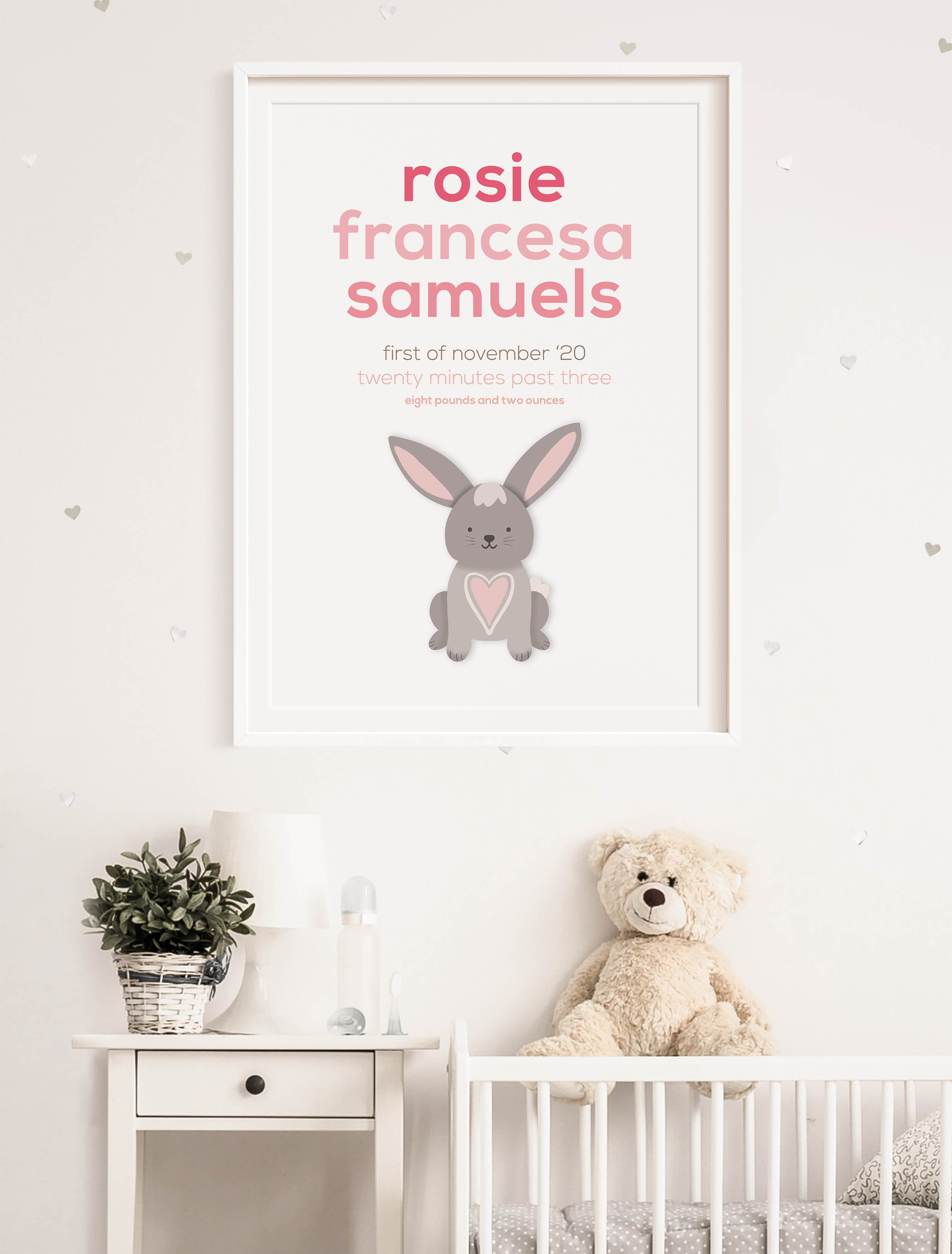 Bunny newborn frame in a frame set in a nursery.